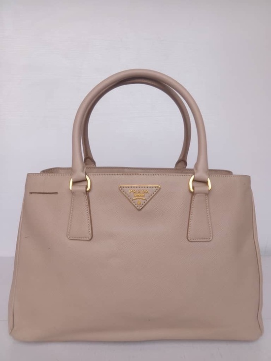 Prada Handbags - Prada Beige Saffiano Tote with Gold Hardware